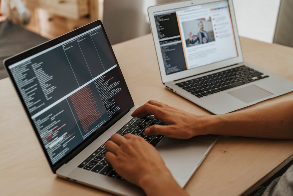 remote entry ai coder at modern desk with AI coding tools open