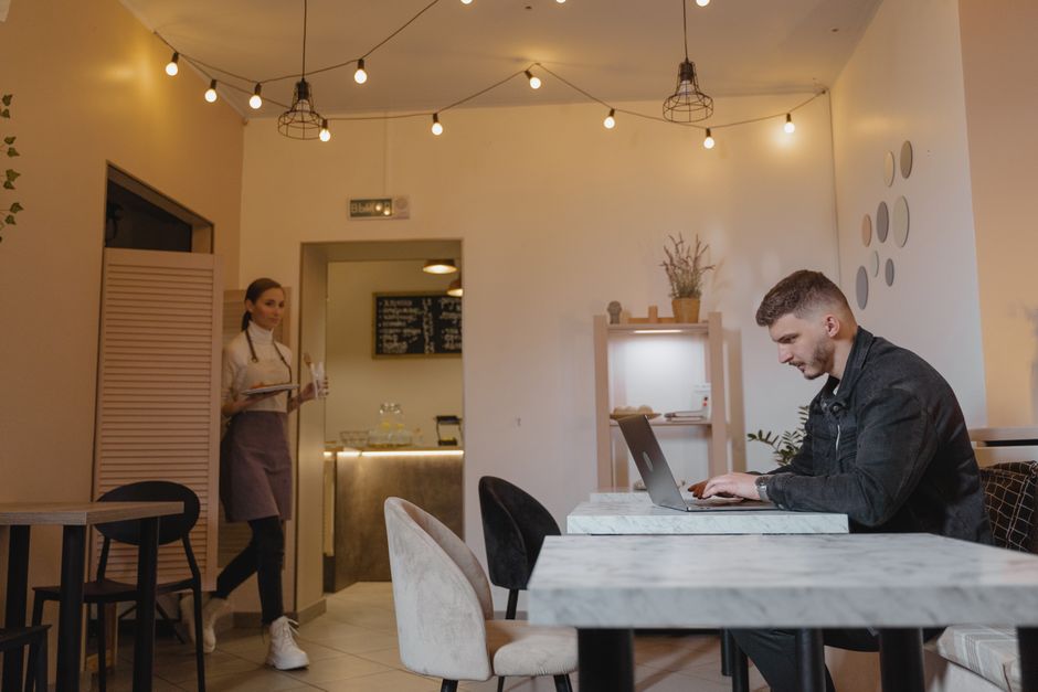 remote worker in NYC coffee shop environment
